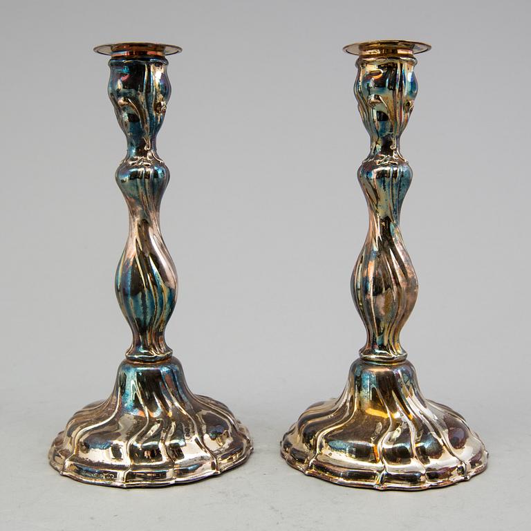 A pair of candlesticks, Swedish importmarks, mid 20th century.