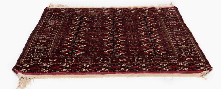 An antique Yomut rug, Western Turkmenistan, c. 119 x 104 cm.