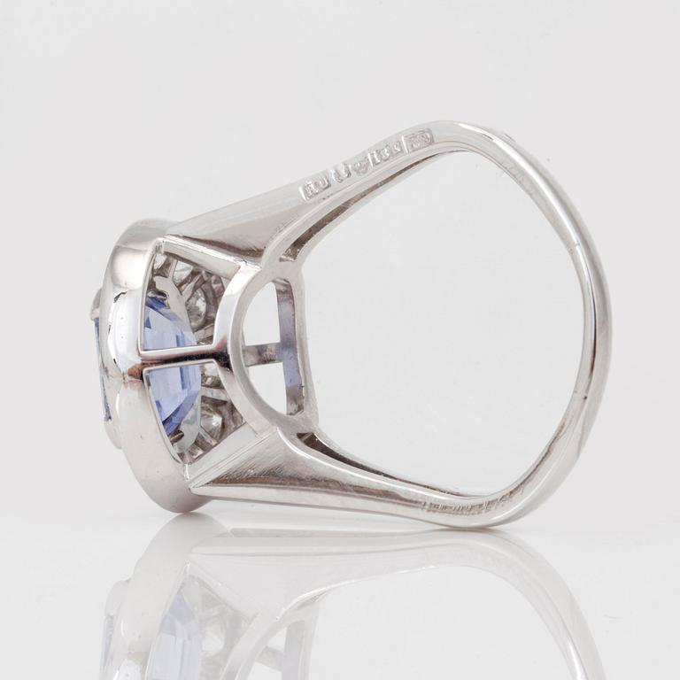 Rey Urban, A circa 3.10ct purple sapphire and diamond ring. Total carat weight circa 0.94ct. Rey Urban, 1970.