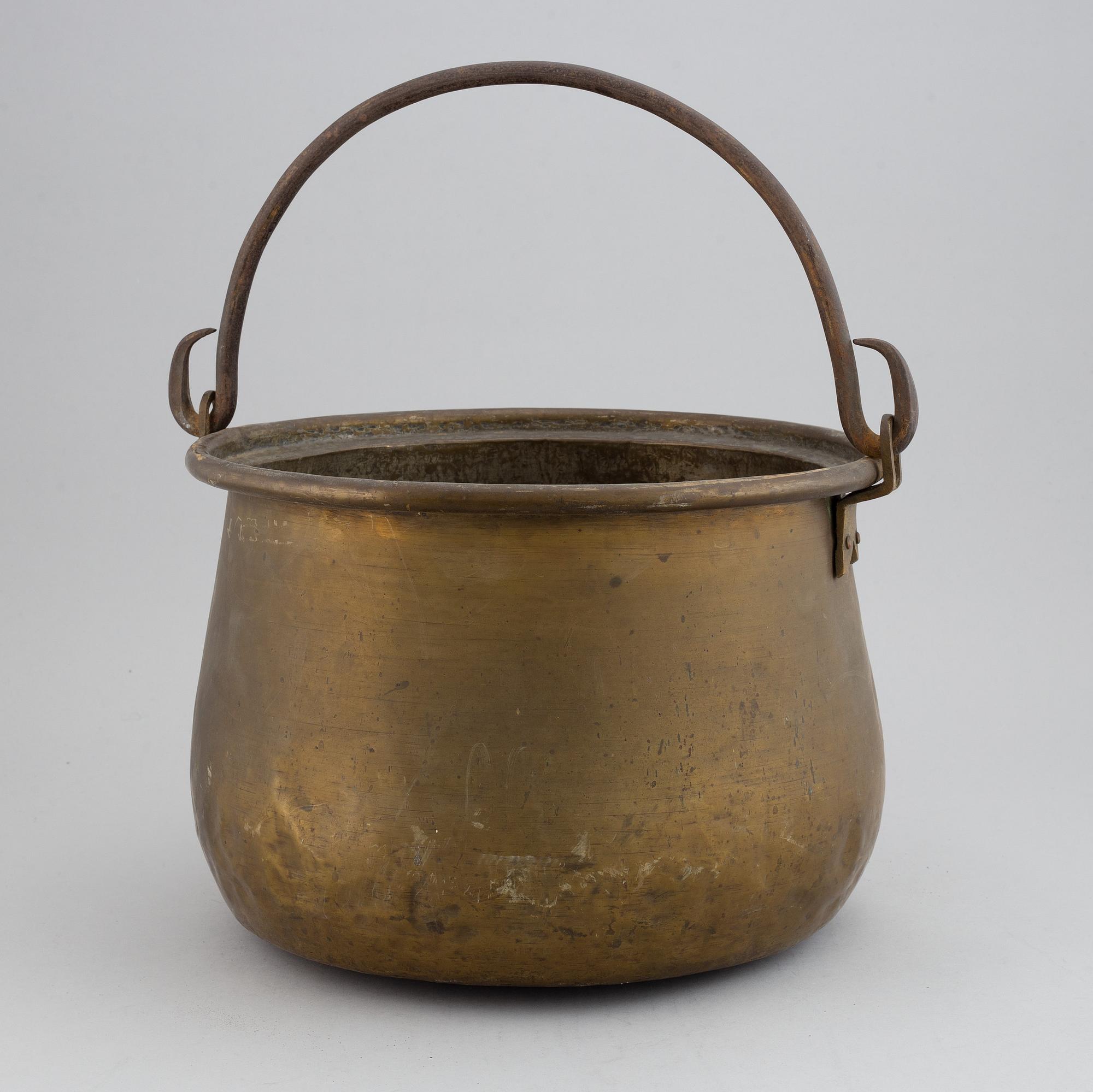 A large 18th century brass cauldron.