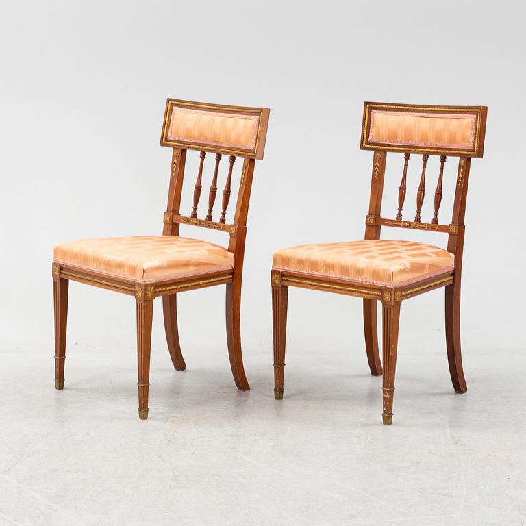 An Empire style table, a sofa and eight chairs, early 20th Century.