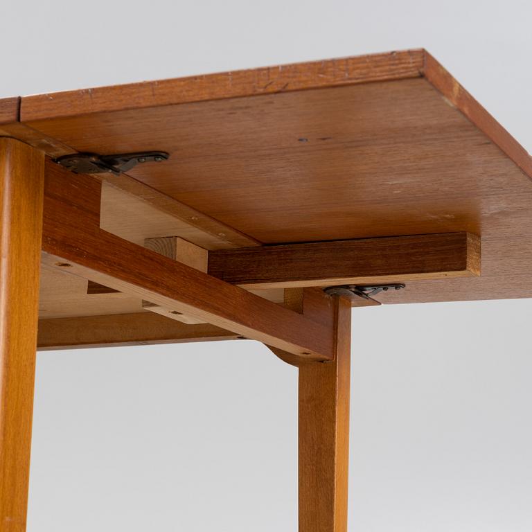 A teak veneered desk, mid 20th Century.