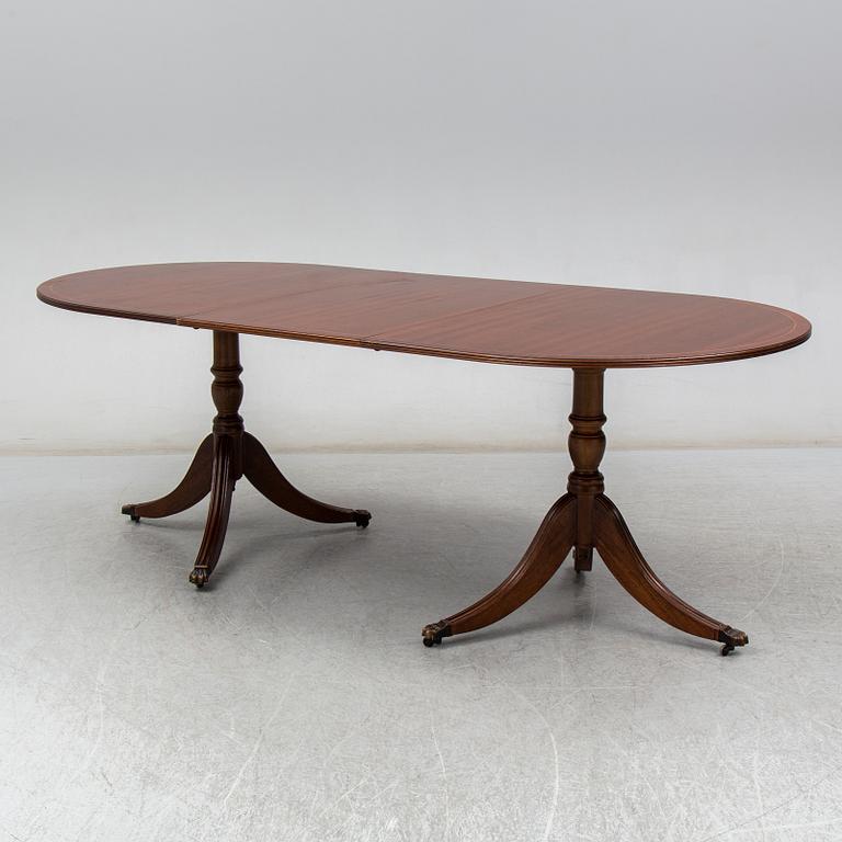 A late 20th century English dining table. One leaf included.