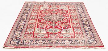 An oriental rug, c. 260 x 162 cm.