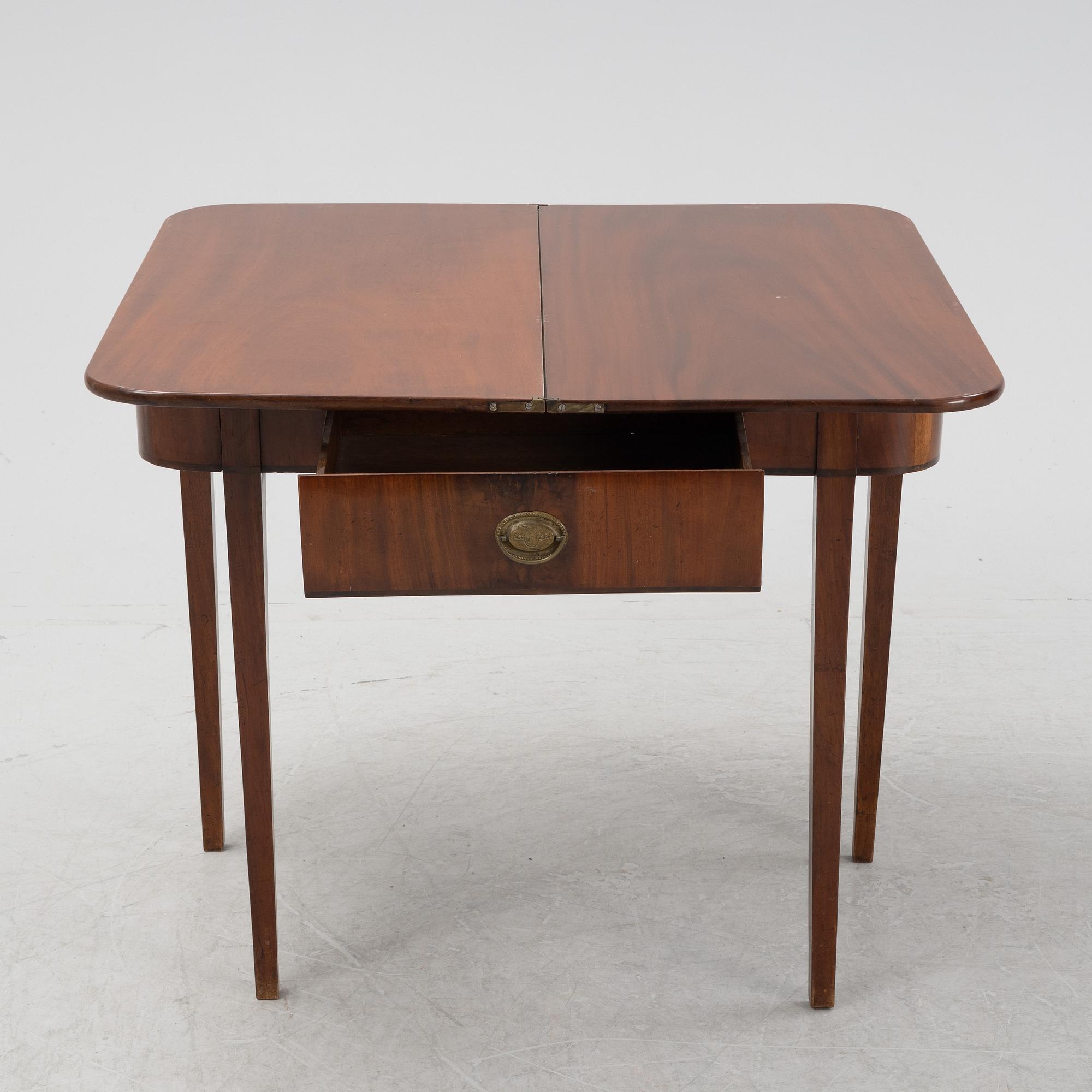 A mahognay card table, early 19th Century.