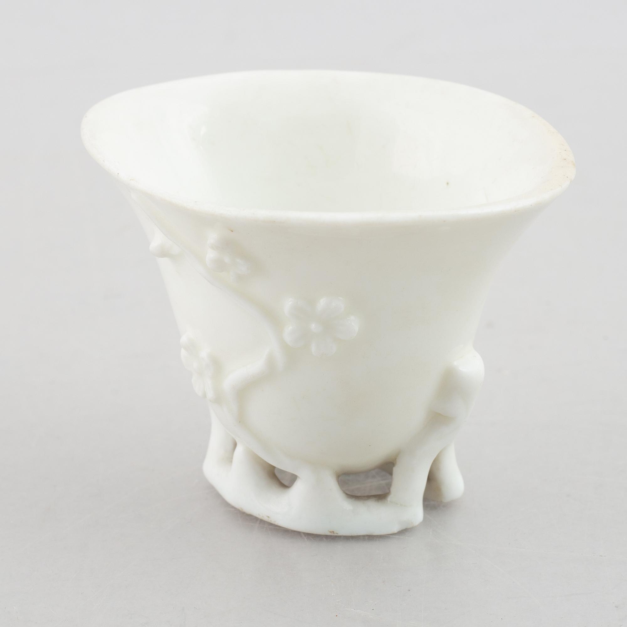 A blanc de chine rhinoceros libation cup, Qing dynasty, 18th century.