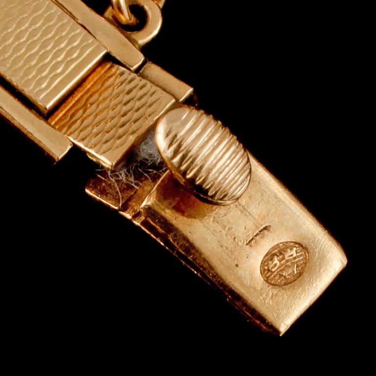 DAMARMBANDSUR, Lagonda Incabloc, 18k guld. 1900-talets mitt. Vikt 18 g.