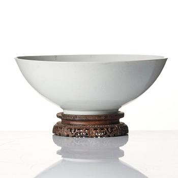 A large white glazed anhua decorated five clawed dragon bowl, Qing dynasty, Yongzheng mark and of the period (1723-35).