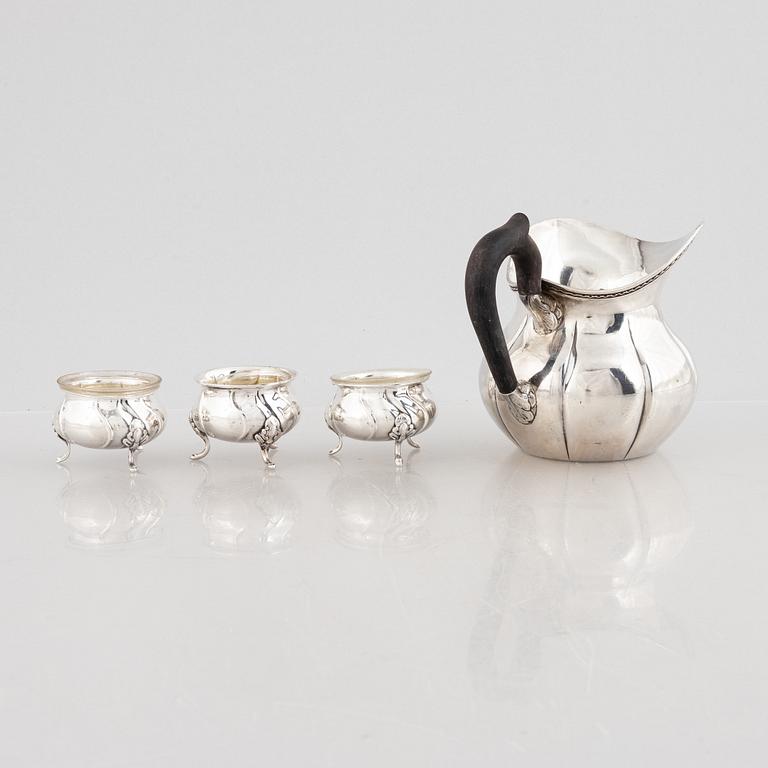 A Danish silver jug and three salt cellars, first half of the 10th Century.