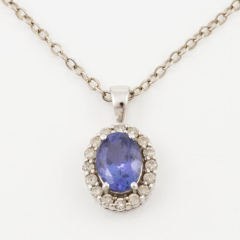 Pendant in 14K white gold set with a faceted tanzanite and round brilliant-cut diamonds.