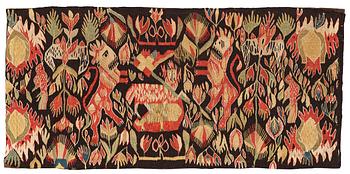 258. A carriage cushion, tapestry weave, "Lammet och fanan", ca 45-47 x 97,5-98 cm, Torna or Bara district,