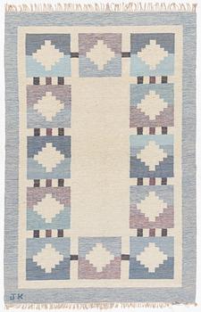 Karin Jönsson, a flat-weave carpet, signed JK, a. 306 x 200 cm.