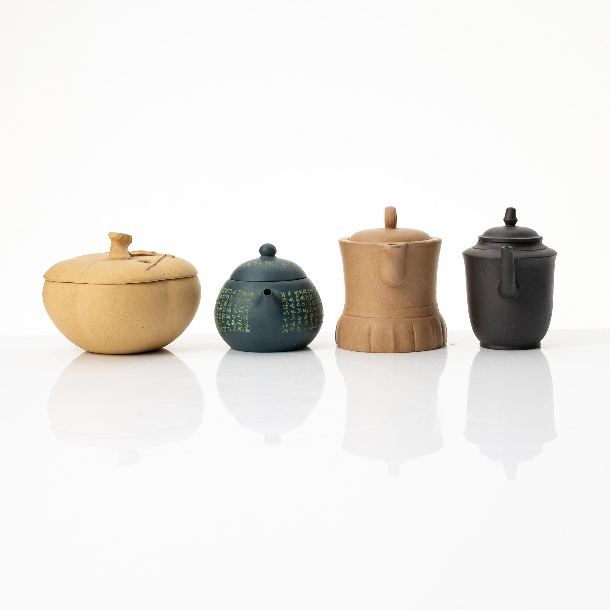 A group of three yixing teapots and a box with cover, China, 1970/80s.