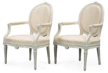 560. A pair of Gustavian 18th Century armchairs.