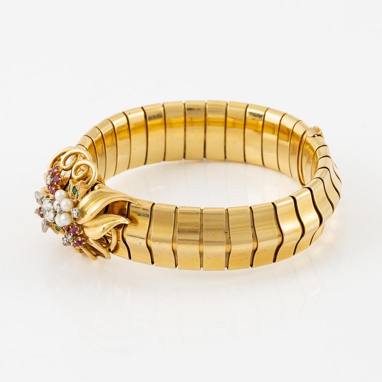A Strömdahls bracelet/pendant combination in 18K gold with rubies, emeralds, pearls and diamonds.