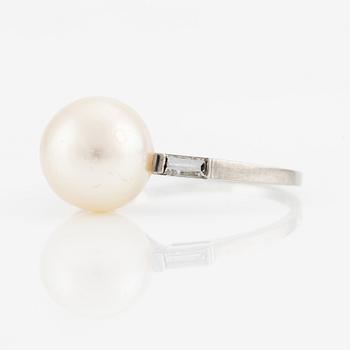 Platinum ring with pearl and baguette-cut diamonds.