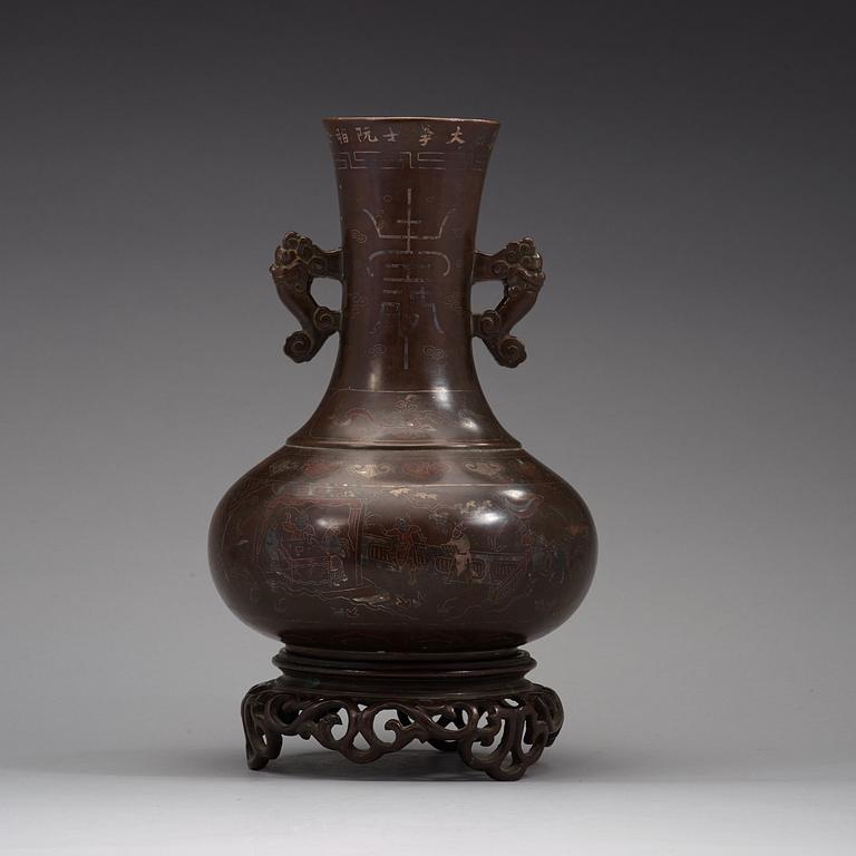 A bronze vase with stand, Qing dynasty (1644-1912).