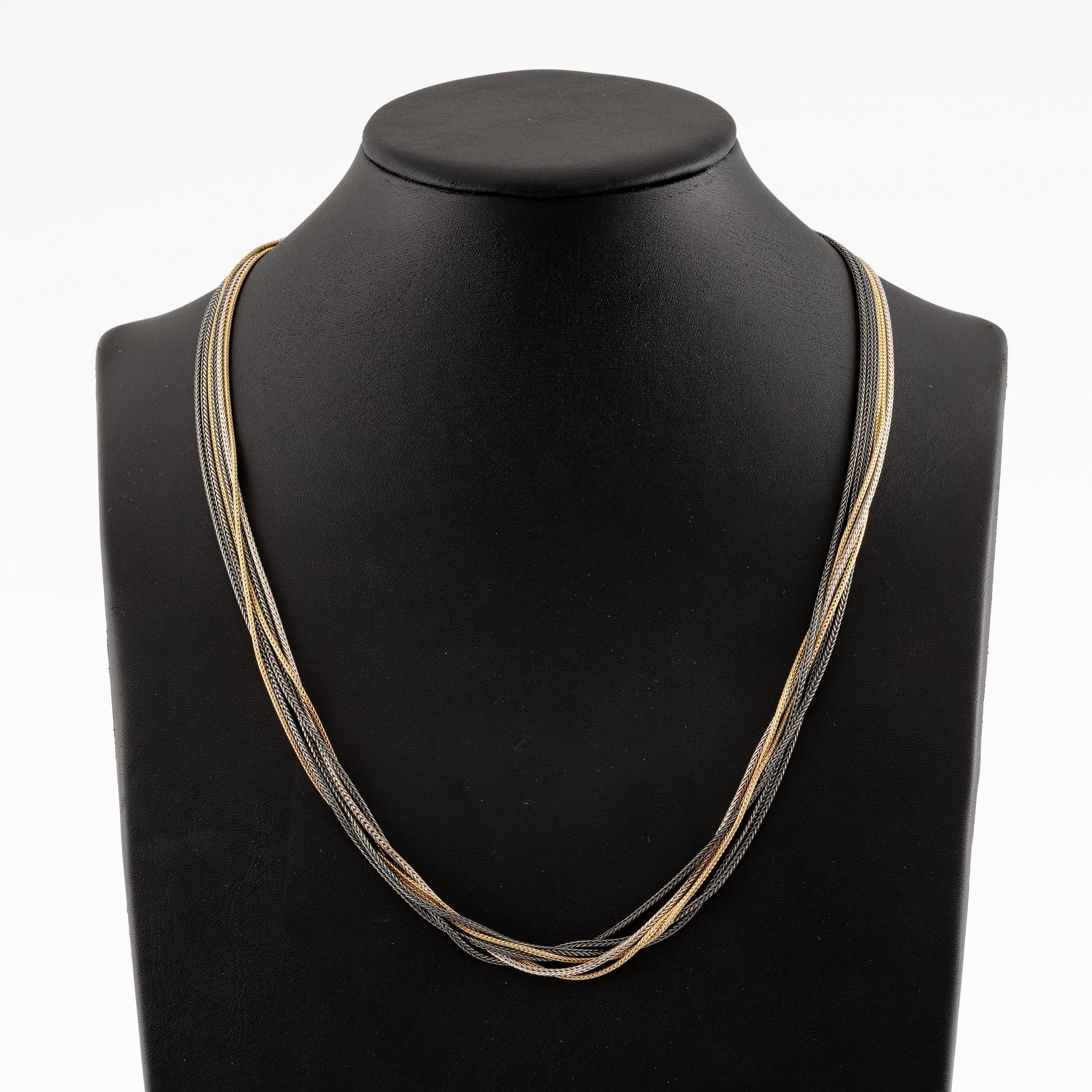 Collier, troligen Ole Lynggaard, sex rader, guld och silver.