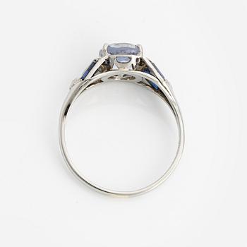 Ring with light blue sapphire.