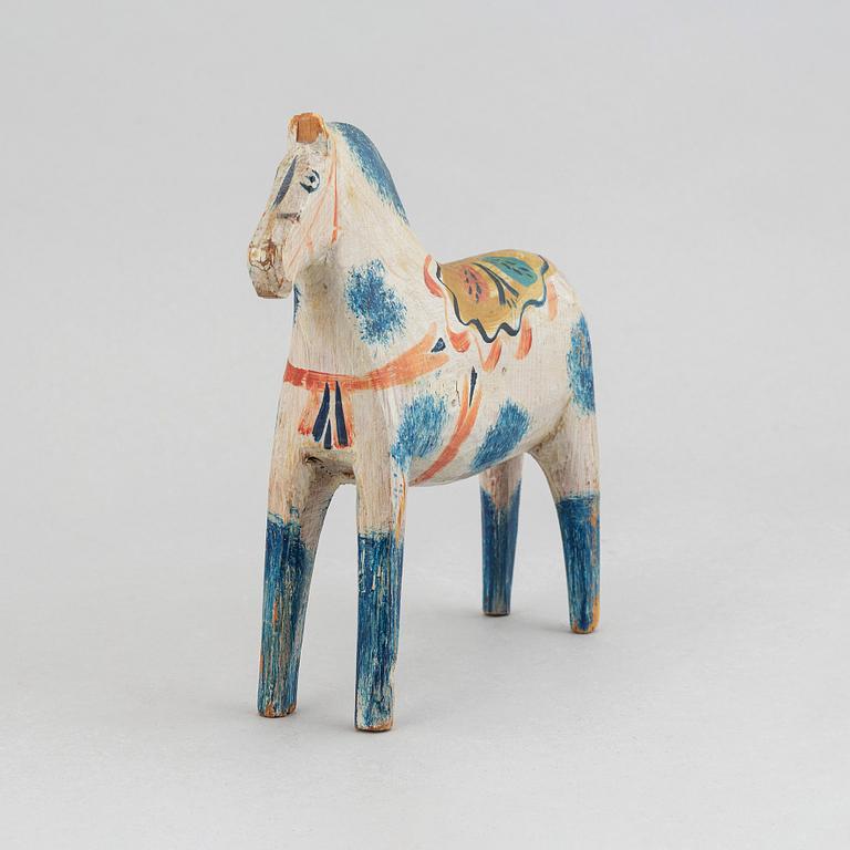 A wooden carved and painted 'Dalahäst', early or mid 20th century.