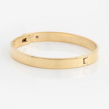 Cartier armband 18K guld med en rund briljantslipad  diamant "Anniversary Bracelet".