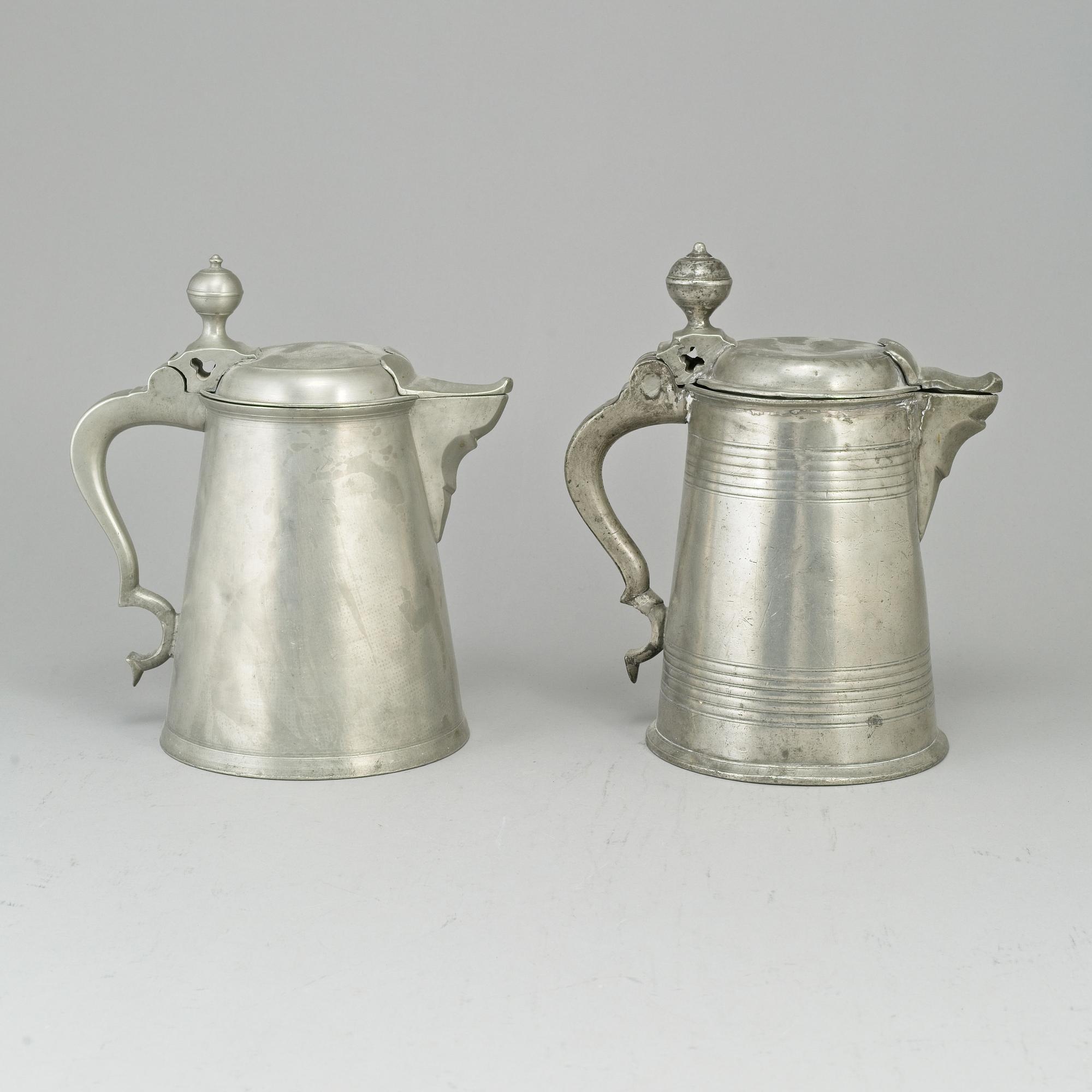 Two pewter tankards, one by Carl Petter Eckerström, Västerås 1833.