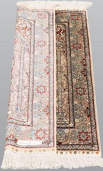 An oriental silk rug, approx. 95 x 63 cm.