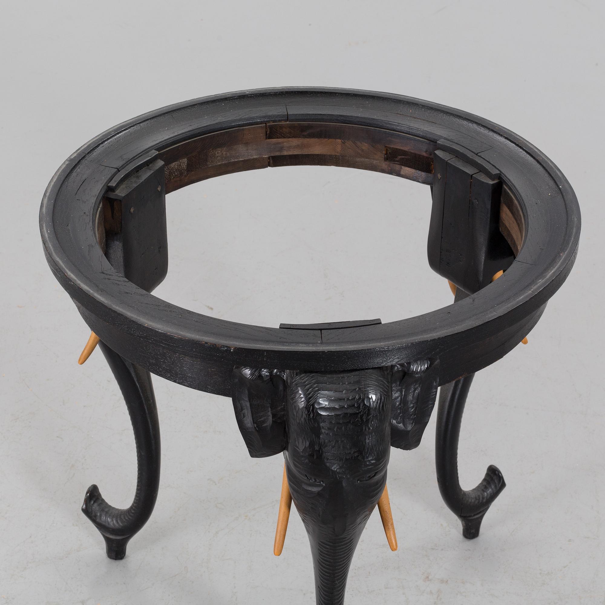 An early 20th Century smoking table, wood and copper.