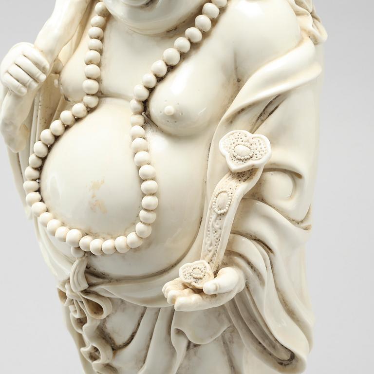 A blanc de Chine porcelian figurine of buddai, 20th Century.