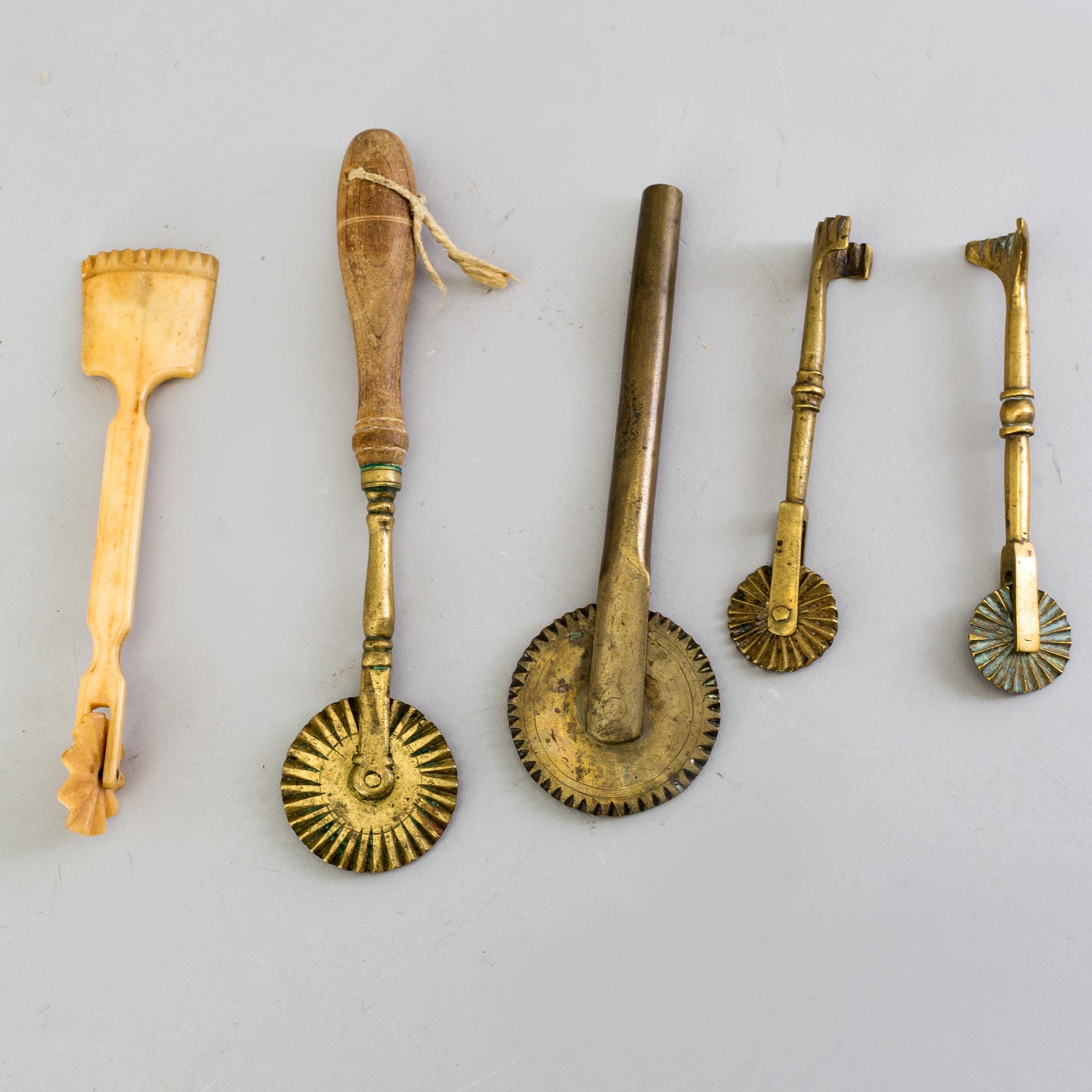 FIVE BAKING UTENSILS, bronze, bone and wood, 18th century.