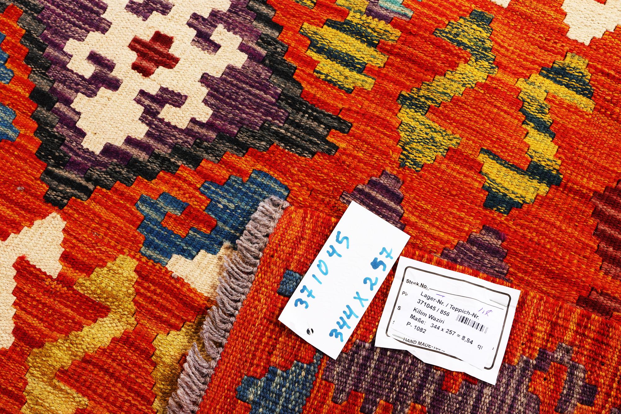 A Kilim carpet, c. 344 x 257 cm.