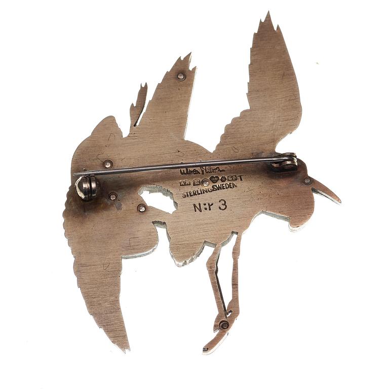 A Wiwen Nilsson sterling brooch of a pair of flying herons, gilt in two colours, Lund 1957.