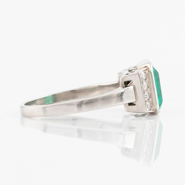 Platinum and emerald and eight cut diamond ring.