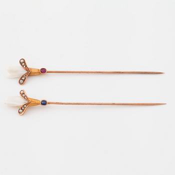 Two pins set with cultured pearls and a synthetic ruby and a synthetic sapphire.