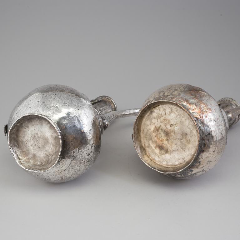 A pair of silver plated jugs, the 20th century.