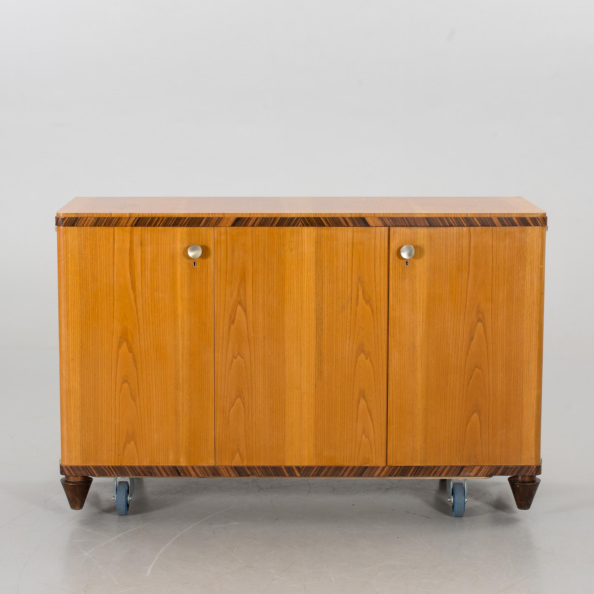 A "MODEL OK" SIDEBOARD DESIGNED BY AXEL EINAR HJORTH FOR NORDISKA KOMPANIET.