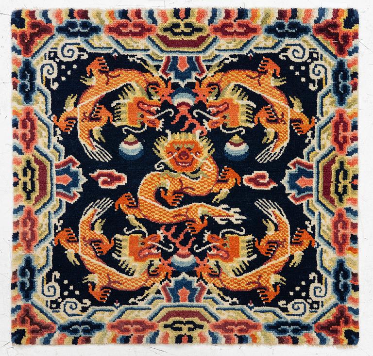 A Chinese small square rug, semi-antique, 65 x 68 cm.