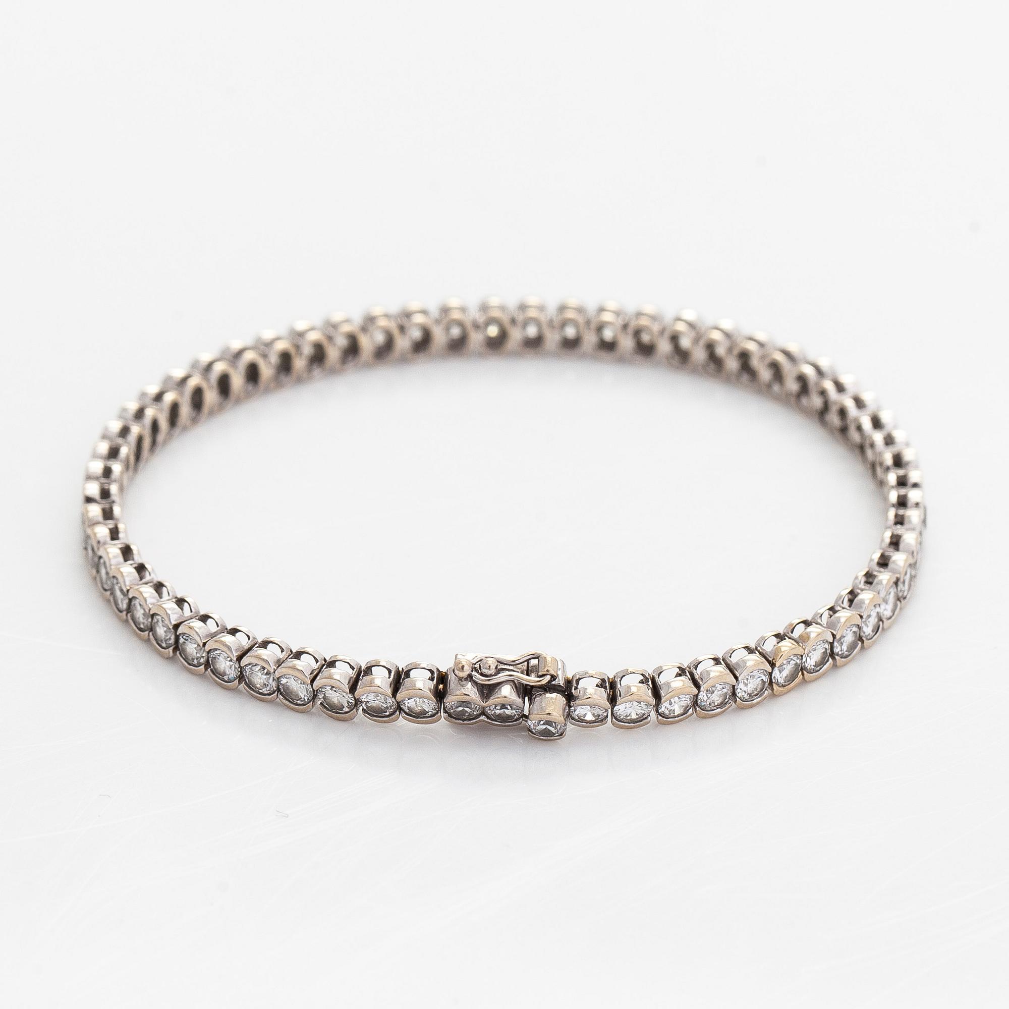 Tennisrannekoru, 18K valkokultaa, briljanttihiottuja timantteja.