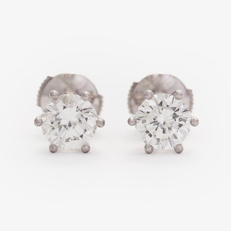 Bucherer, a pair of 18K white gold earrings with brilliant-cut diamond. SJL-certificate.
