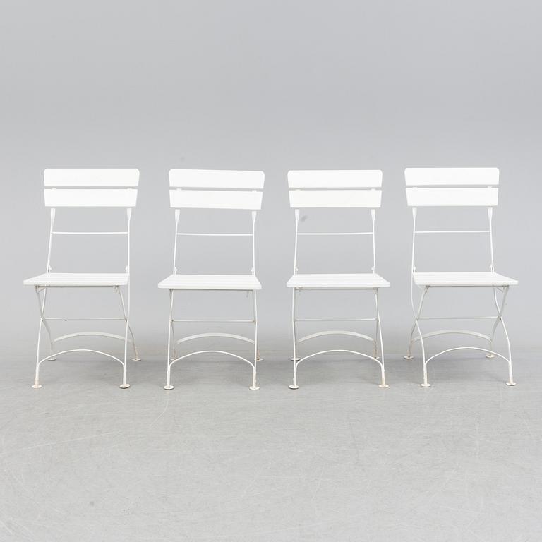 A Garden table with 4 chairs.