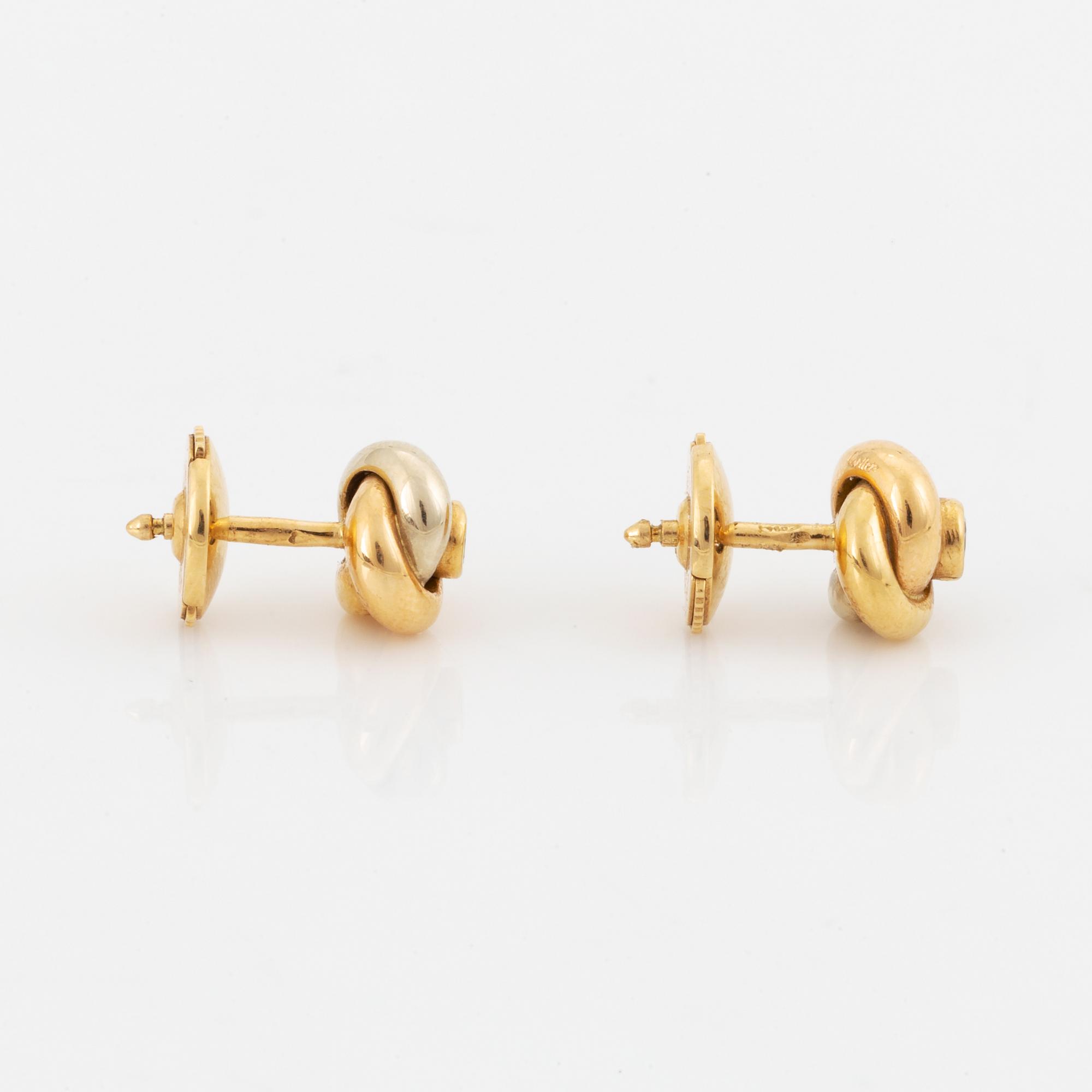 Ett par örhängen Cartier "Trinity" 18K guld med runda briljantslipade diamanter.