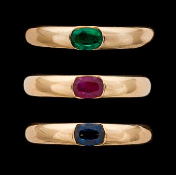 1074. Cartier gold rings with ruby, emerald and blue sapphire.