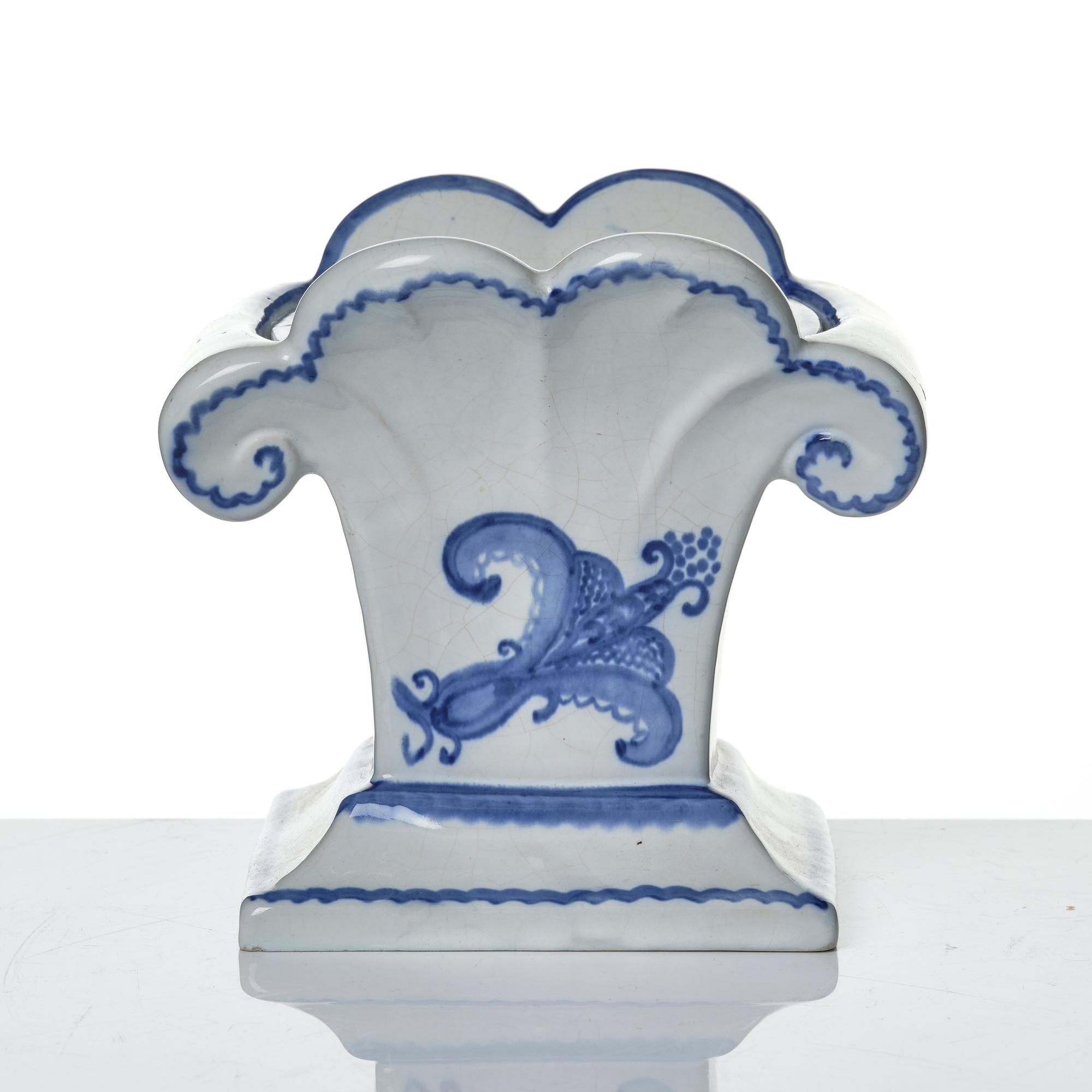 Wilhelm Kåge, eleven pieces of faience including jars, inkwells and a tulip vase, Gustavsberg, Sweden, 1919-1920.