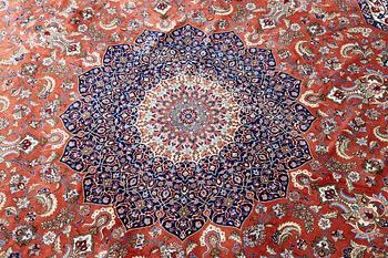 An Oktagonal  silk Qum rug, Central Persia, signed, c. 250 x 250 cm.