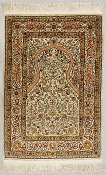 A silk Hereke possibly, around 96 x 66 cm.