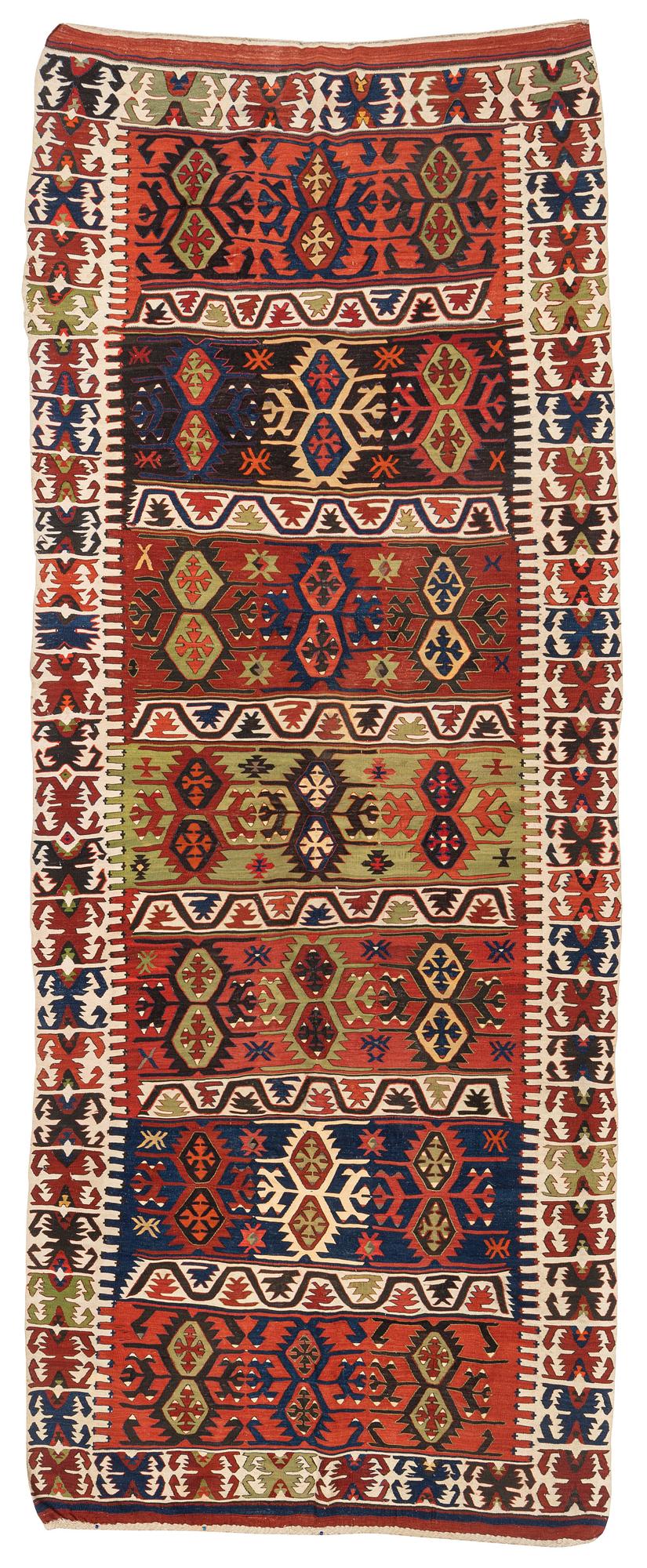 An antique southeast Anatolian kilim, c. 412 x 163 cm.