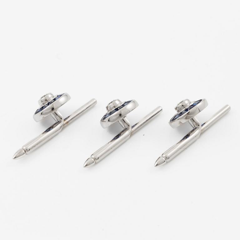 Three shirt buttons in 18K and 14K white gold set with faceted sapphires and round brilliant-cut diamonds.