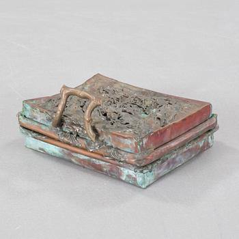 a metal sculpture, signed and dated -83.