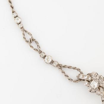 A brooch/necklace combination in 18K white gold set with old- and eight-cut diamonds.