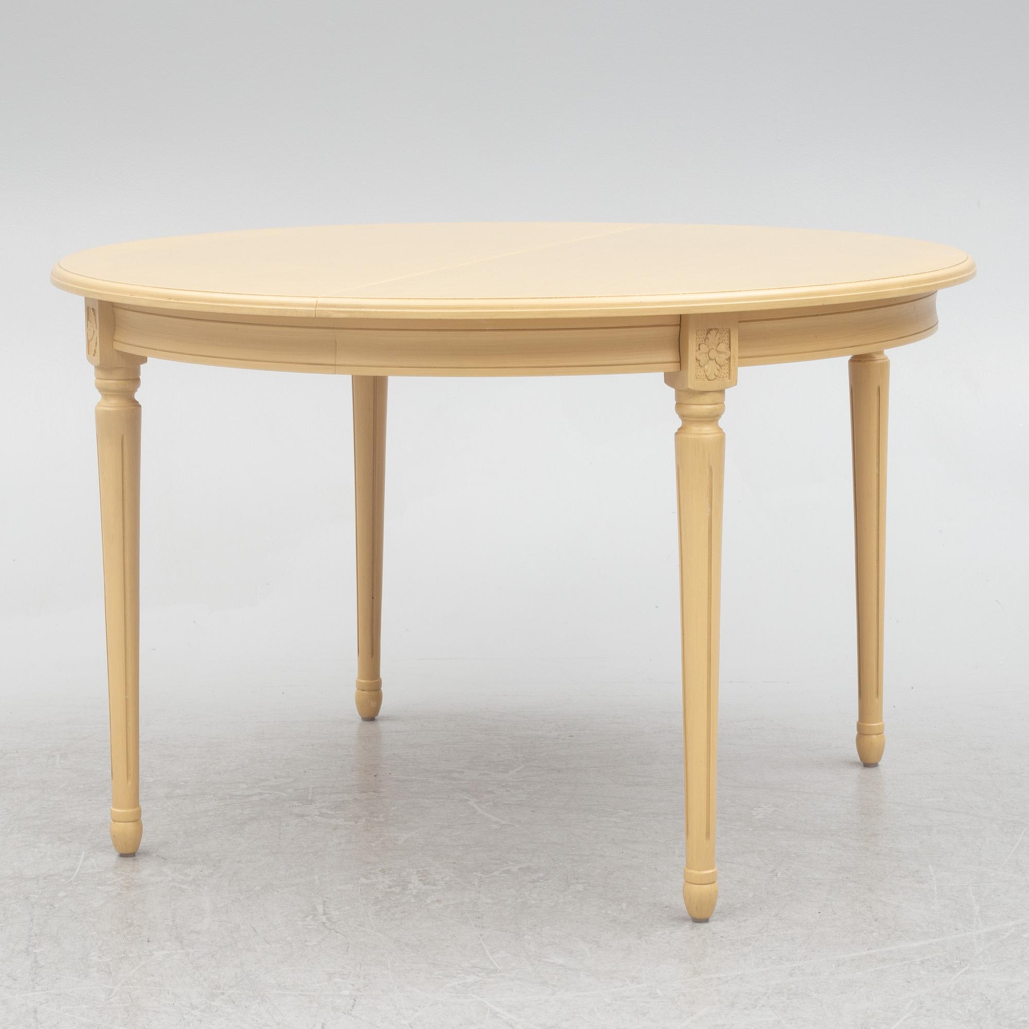 A Gustavian style dining table with six dining chairs, Sweden, 21st century.